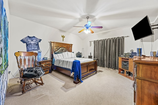 carpeted bedroom featuring ceiling fan and vaulted ceiling