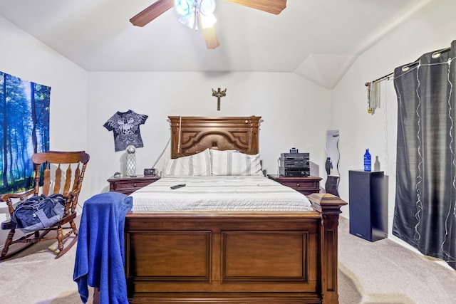 carpeted bedroom with ceiling fan and lofted ceiling