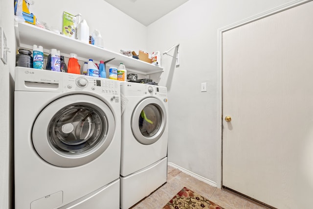 washroom with light tile patterned flooring and separate washer and dryer