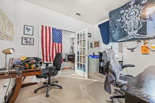 carpeted home office featuring french doors