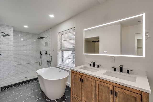 bathroom featuring vanity, tile patterned floors, ceiling fan, and separate shower and tub