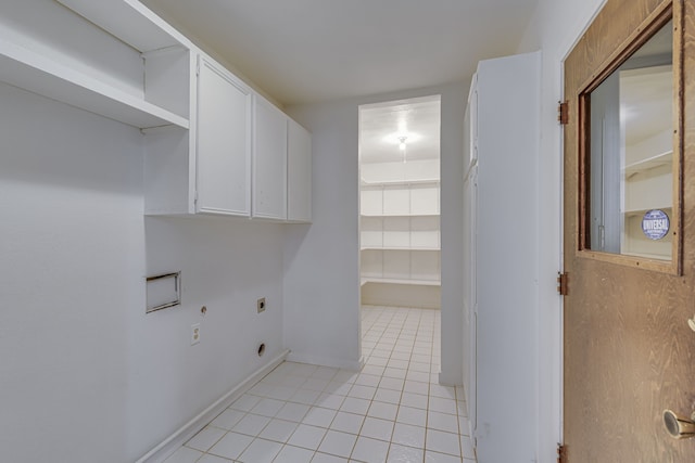 laundry area with cabinets, hookup for an electric dryer, hookup for a washing machine, and light tile patterned floors