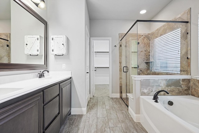 bathroom with plus walk in shower and vanity