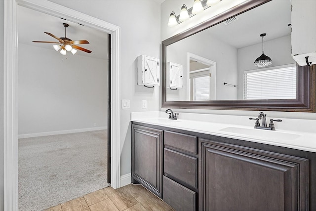 bathroom featuring ceiling fan and vanity