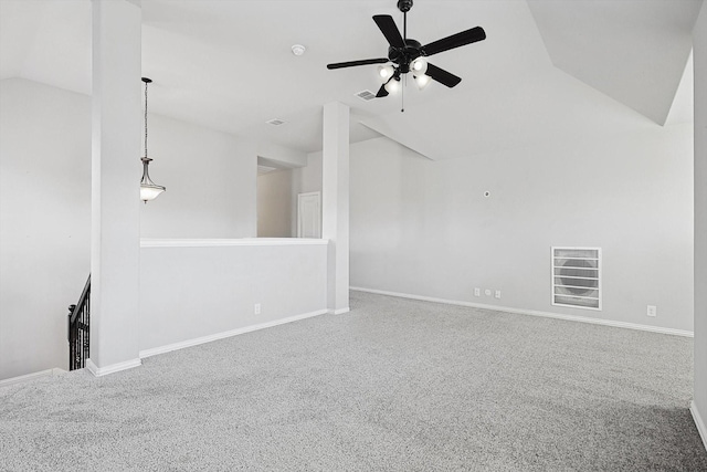 unfurnished living room with ceiling fan, vaulted ceiling, and carpet flooring