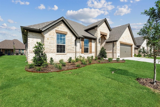 view of front of house featuring a front yard and a garage