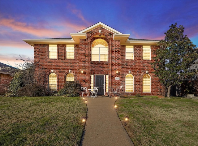 view of front of home with a yard