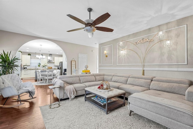 living room with hardwood / wood-style flooring and ceiling fan