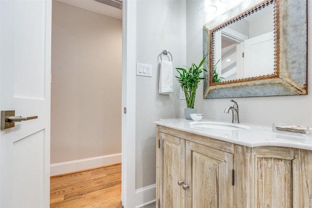 bathroom featuring wood-type flooring and vanity