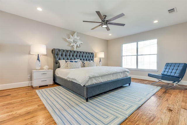 bedroom with ceiling fan and light hardwood / wood-style flooring