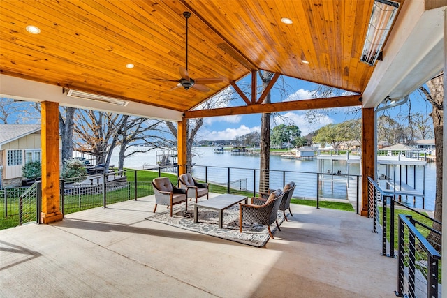 view of patio with a gazebo, ceiling fan, outdoor lounge area, and a water view