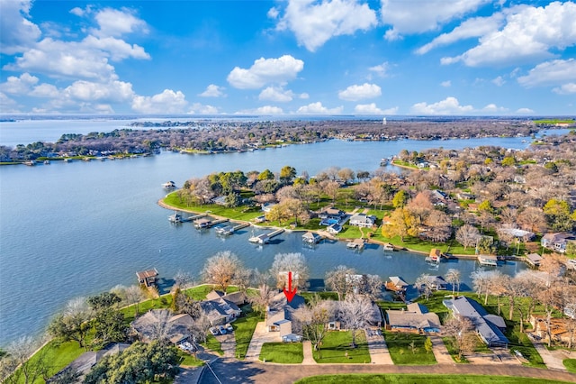 birds eye view of property featuring a water view