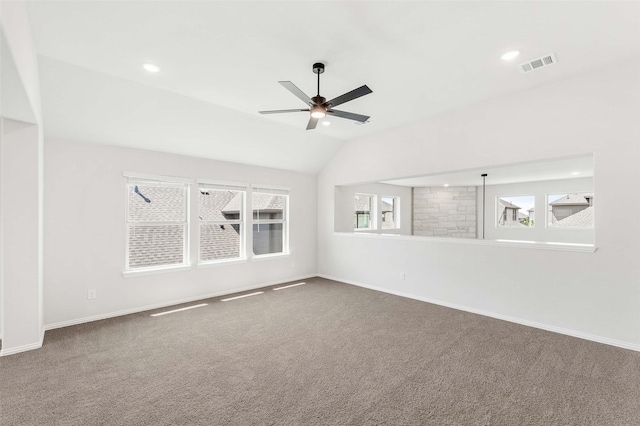 carpeted empty room with ceiling fan, baseboards, and visible vents