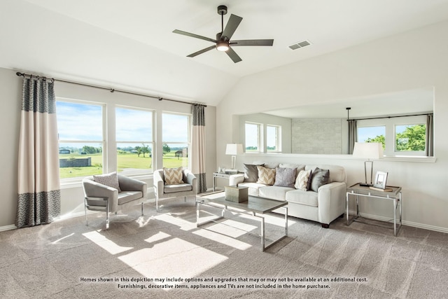 living room featuring carpet floors, ceiling fan, and vaulted ceiling