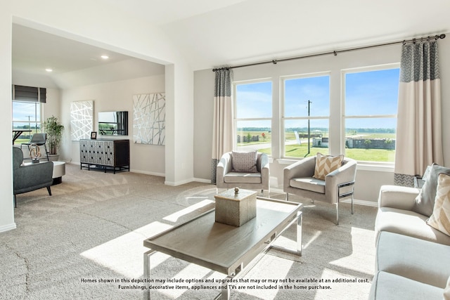 carpeted living room featuring vaulted ceiling