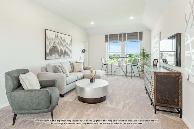 carpeted living room with lofted ceiling