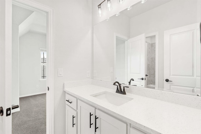bathroom with baseboards and vanity