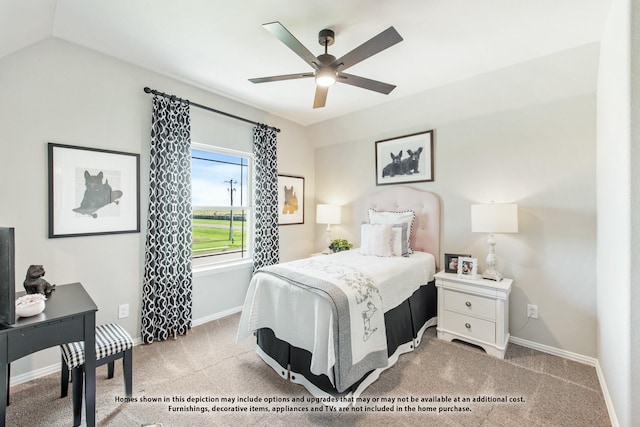 carpeted bedroom with ceiling fan and vaulted ceiling