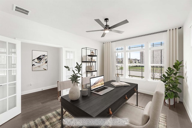 home office featuring visible vents, a ceiling fan, baseboards, and dark wood-style flooring