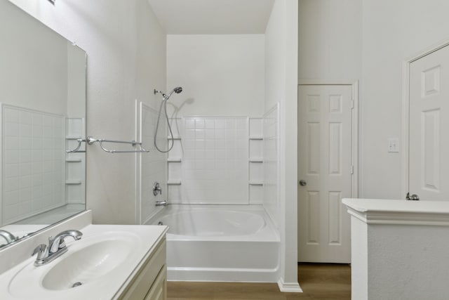 bathroom featuring vanity, bathing tub / shower combination, and hardwood / wood-style floors