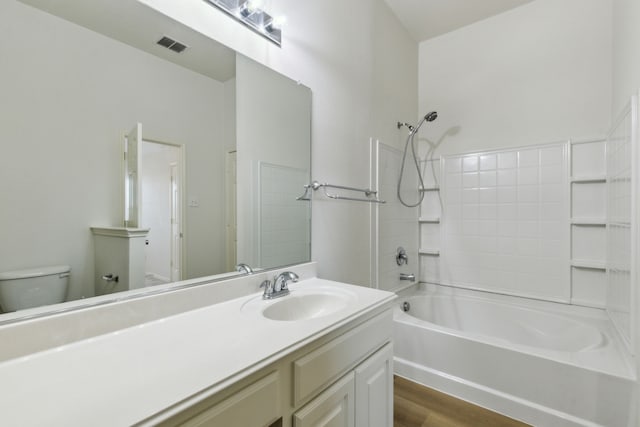 full bathroom with shower / bath combination, toilet, vanity, and hardwood / wood-style flooring