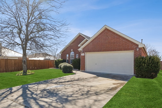 view of front of home featuring a garage and a front yard