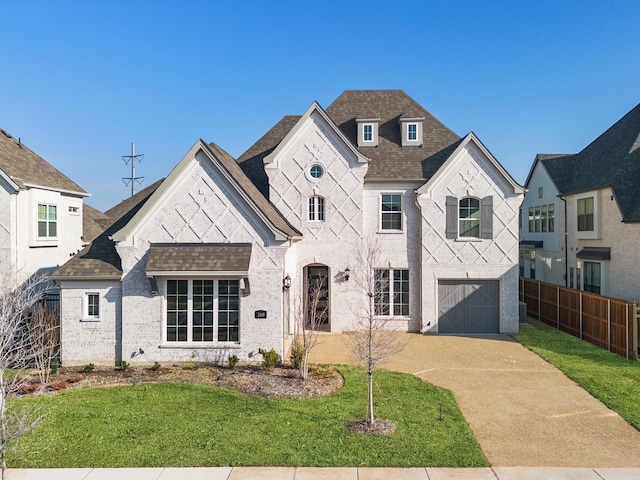 view of front facade featuring a front lawn and a garage