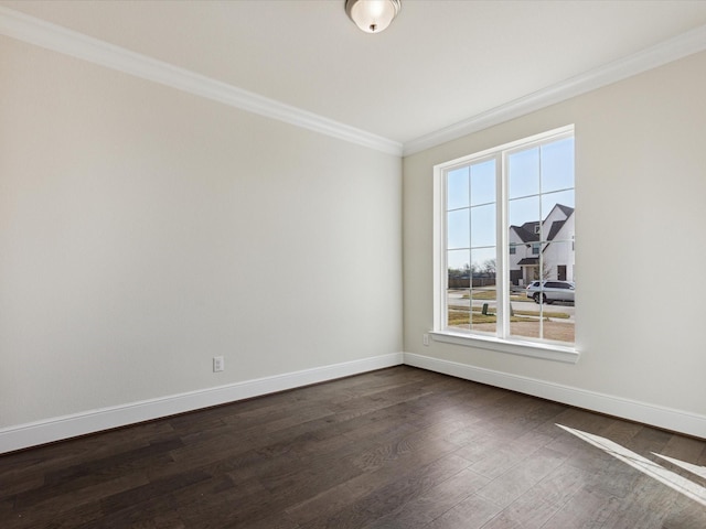 unfurnished room with ornamental molding and dark hardwood / wood-style floors