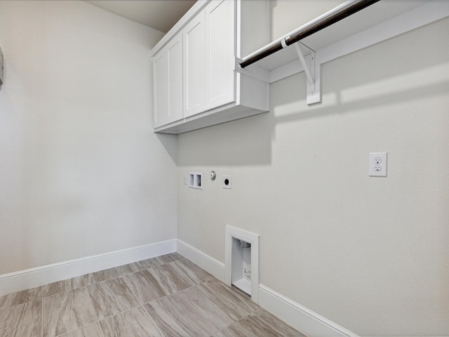 washroom with electric dryer hookup, hookup for a washing machine, cabinets, and gas dryer hookup