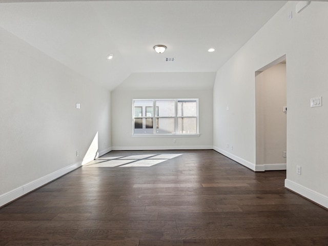 unfurnished living room featuring dark hardwood / wood-style flooring and lofted ceiling