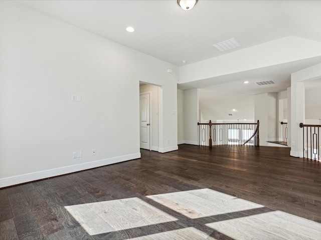 empty room featuring dark wood-type flooring