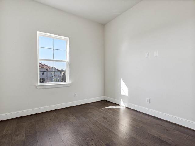 unfurnished room featuring dark wood-type flooring