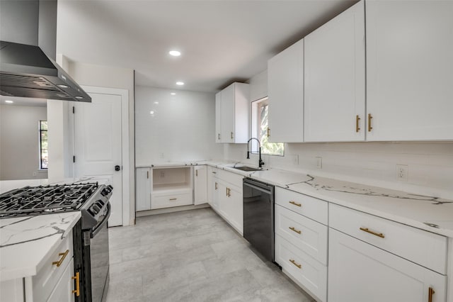 kitchen featuring sink, white cabinets, light stone counters, range hood, and black appliances