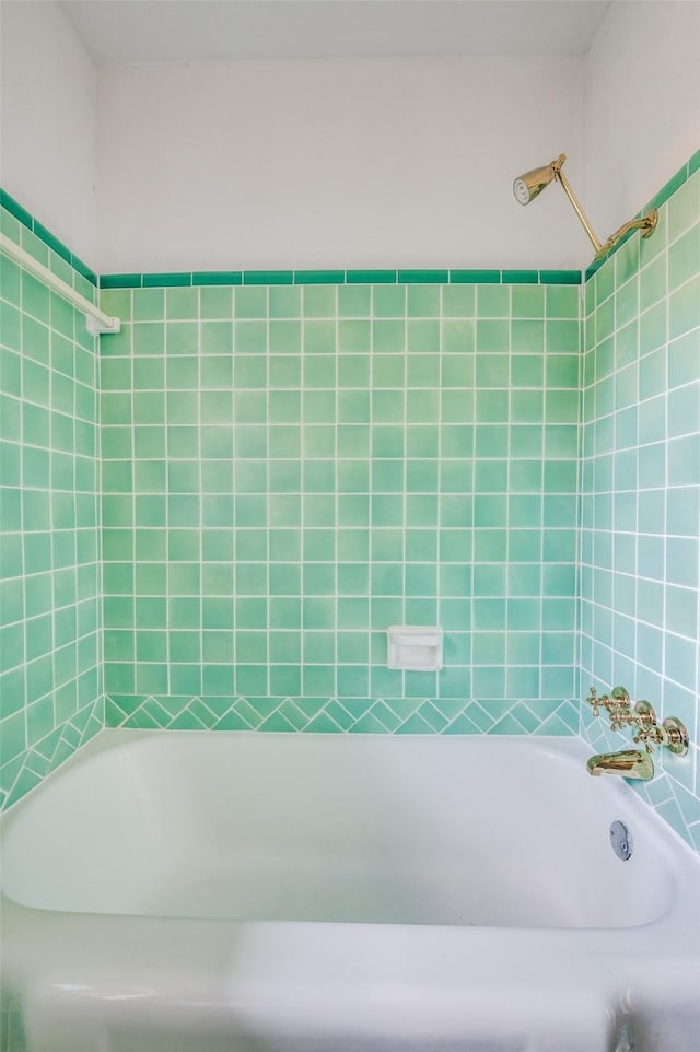 bathroom featuring a washtub