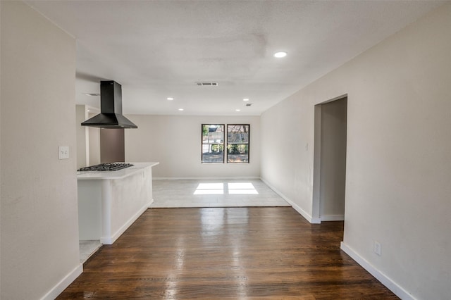 unfurnished living room featuring dark hardwood / wood-style flooring