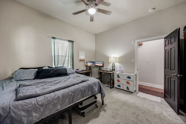 bedroom with light carpet and ceiling fan