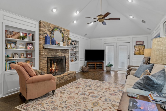 115 Juanita Ave, Wills Point, TX 75169 - living room featuring wood finished floors, built in features, ceiling fan, a brick fireplace, and lofted ceiling