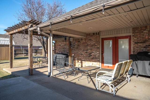 view of patio featuring grilling area and a pergola