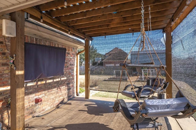 view of patio with an outdoor fireplace