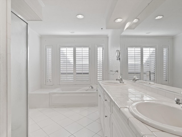 bathroom with tiled bath, ornamental molding, tile patterned floors, and a wealth of natural light