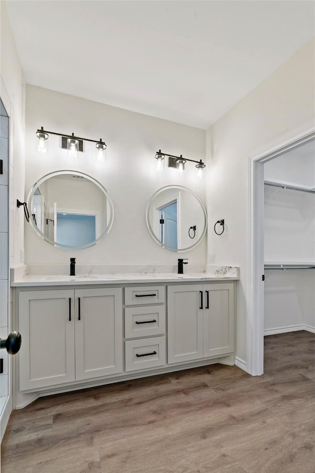 bathroom featuring vanity and hardwood / wood-style floors