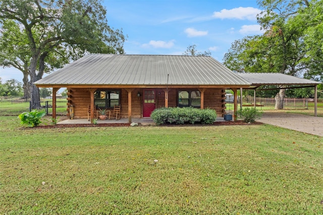 view of front of house with a front yard and covered porch