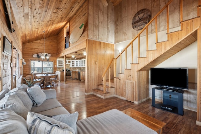 living room with wooden ceiling, an inviting chandelier, hardwood / wood-style flooring, wood walls, and high vaulted ceiling