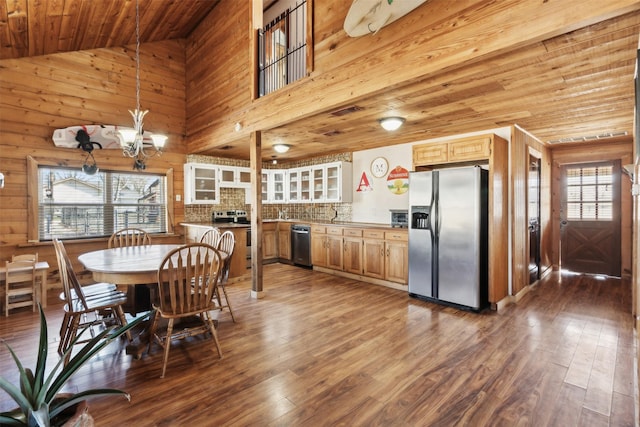 dining room with lofted ceiling, wooden ceiling, a notable chandelier, and dark hardwood / wood-style floors