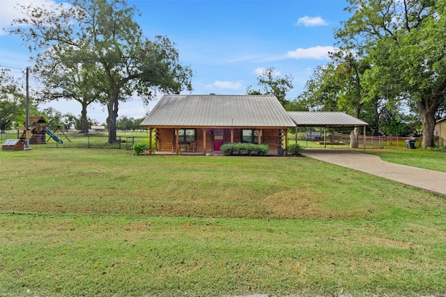 log-style house with a playground and a front lawn