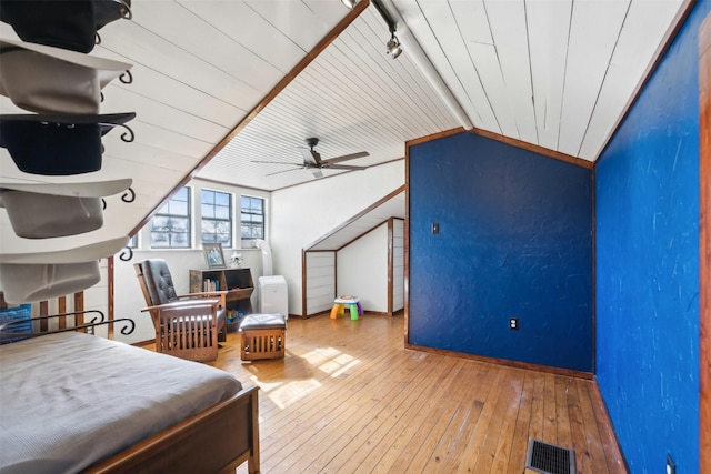 bedroom featuring lofted ceiling, wooden ceiling, hardwood / wood-style floors, and ceiling fan