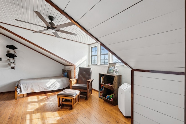 bedroom with ceiling fan, light wood-type flooring, and vaulted ceiling