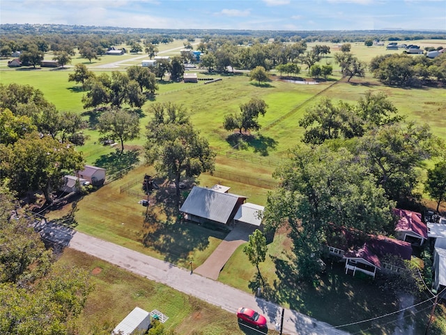 birds eye view of property with a rural view