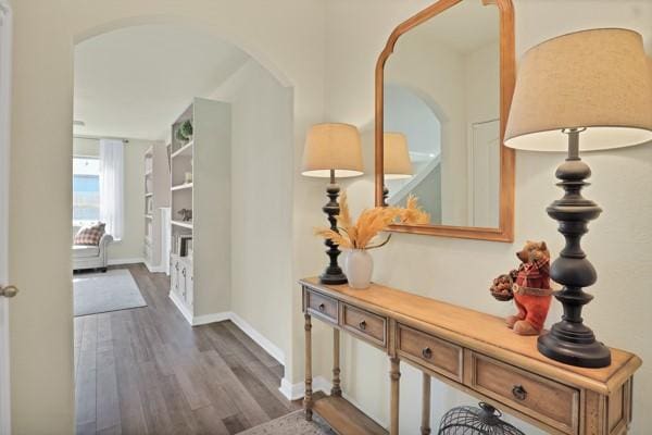 hall with dark hardwood / wood-style floors