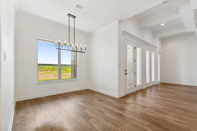 interior space with baseboards, ornamental molding, beamed ceiling, wood finished floors, and an inviting chandelier